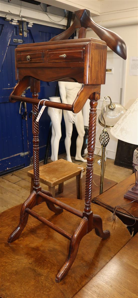 A gentlemans mahogany valet, fitted two small drawers, over turned rails H.120cm